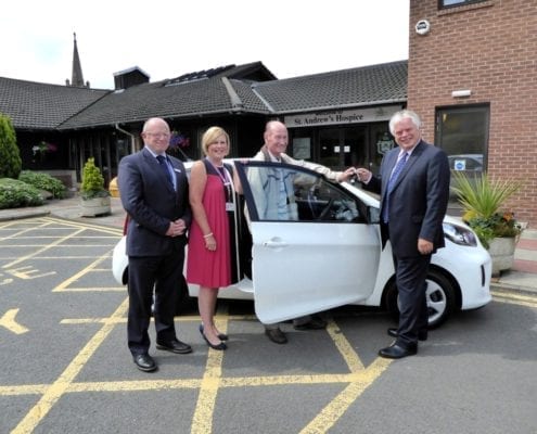 Grand Car Raffle winner collects prize